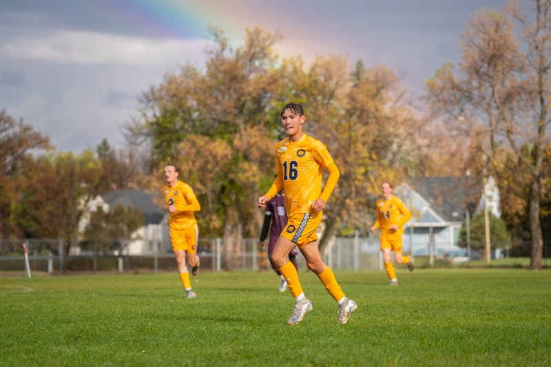 Keaston Brooker playing soccer for Brandon University.