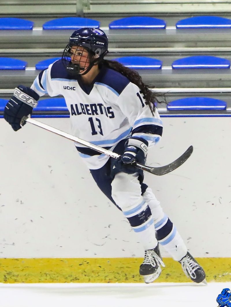 Kurtia Yetman playing hockey for Albertus Magnus.