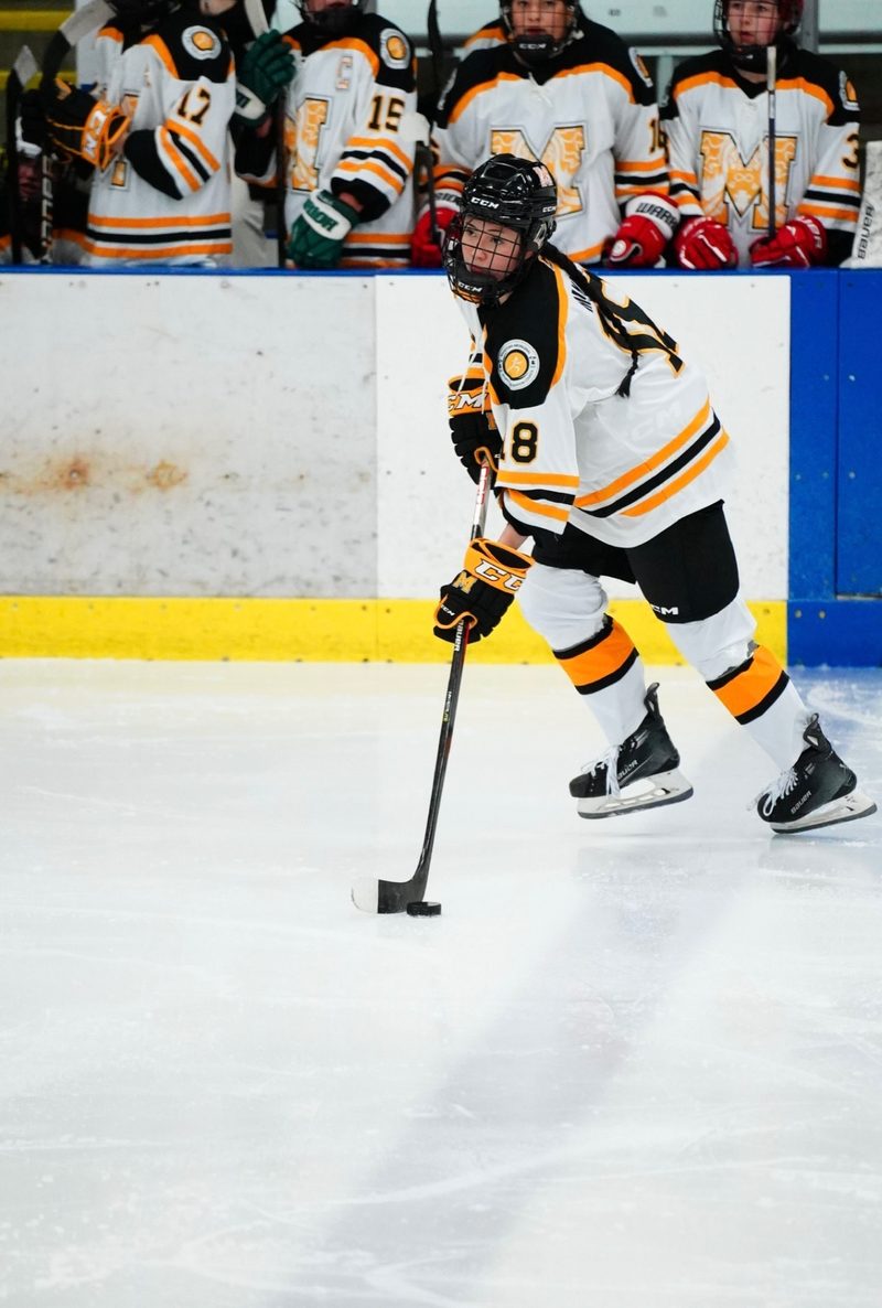 Kurtia Yetman playing hockey.